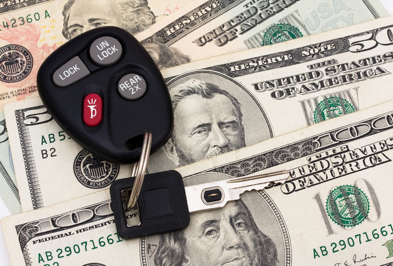 car keys and cash represents an auto title loan