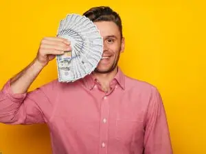 man with a big smile on his face because he just secured an auto registration loan