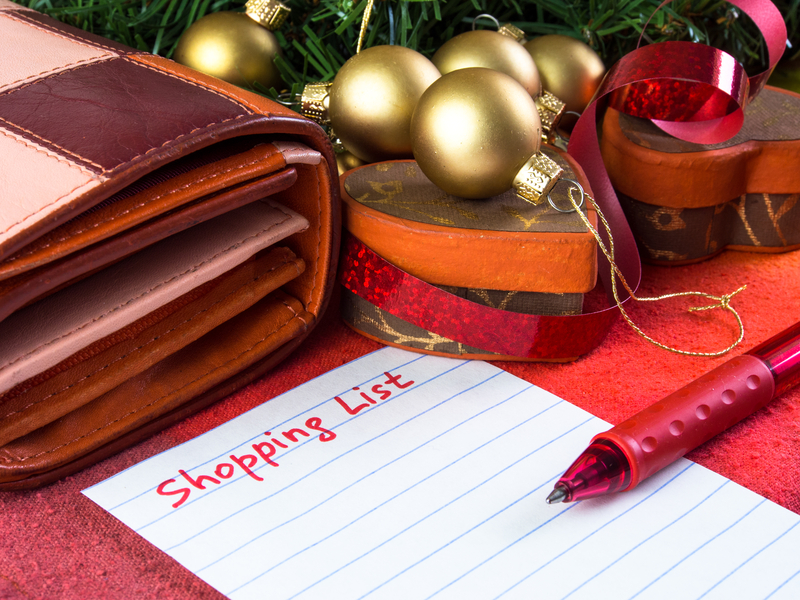 Christmas shopping list with pen and wallet